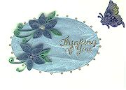 Blue quilling on light blue mulberry paper